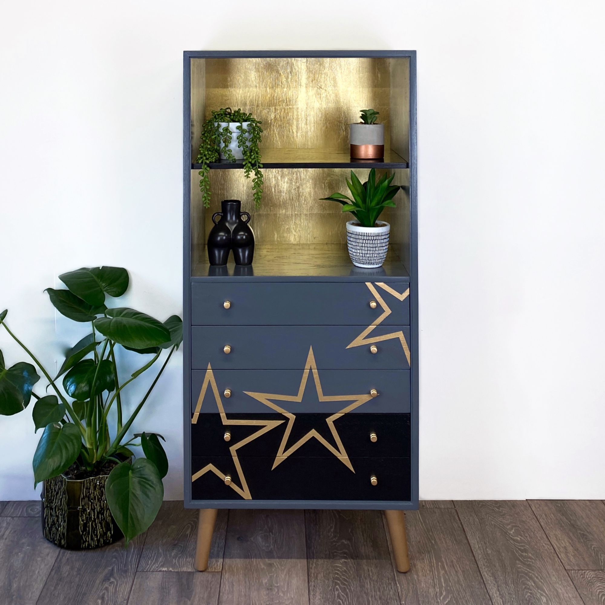 Grey and black upcycled mid century storage unit with handpaingted gold stars